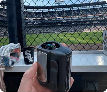 Worker holding the Arctic Clip at a ballpark
