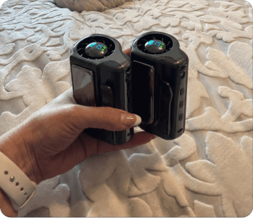 Two Arctic Clip units held in hand