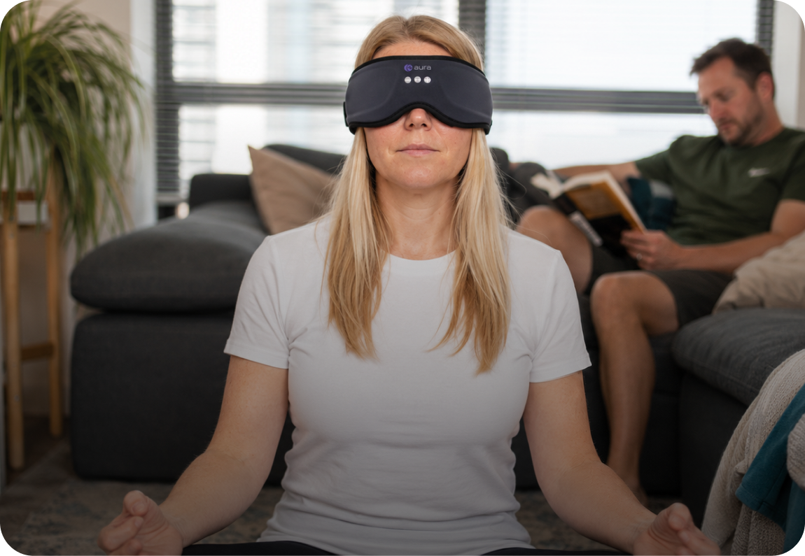 Woman listening privately while her partner reads beside her
