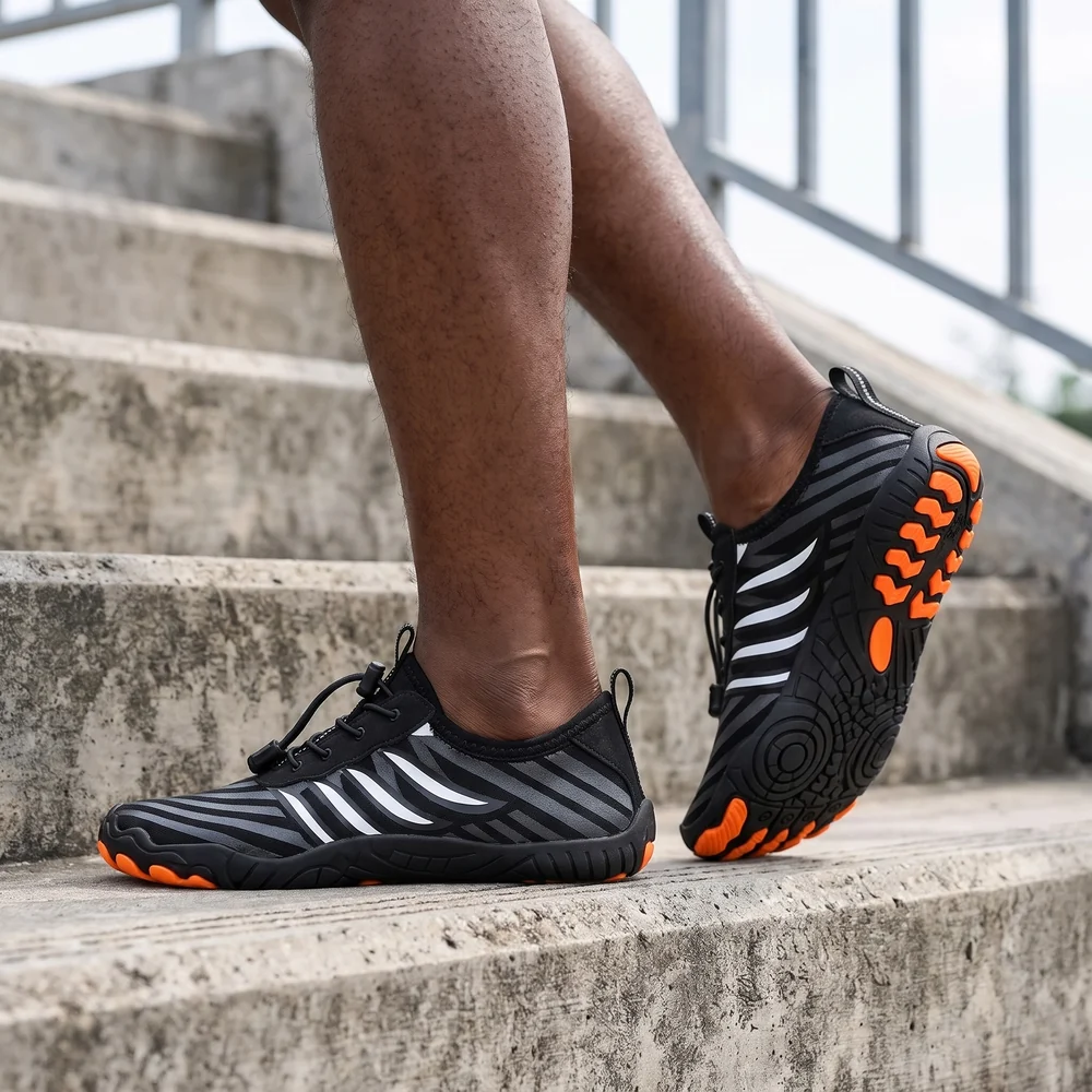 Grounded Footwear® Freedom in Black Orca, worn on steps