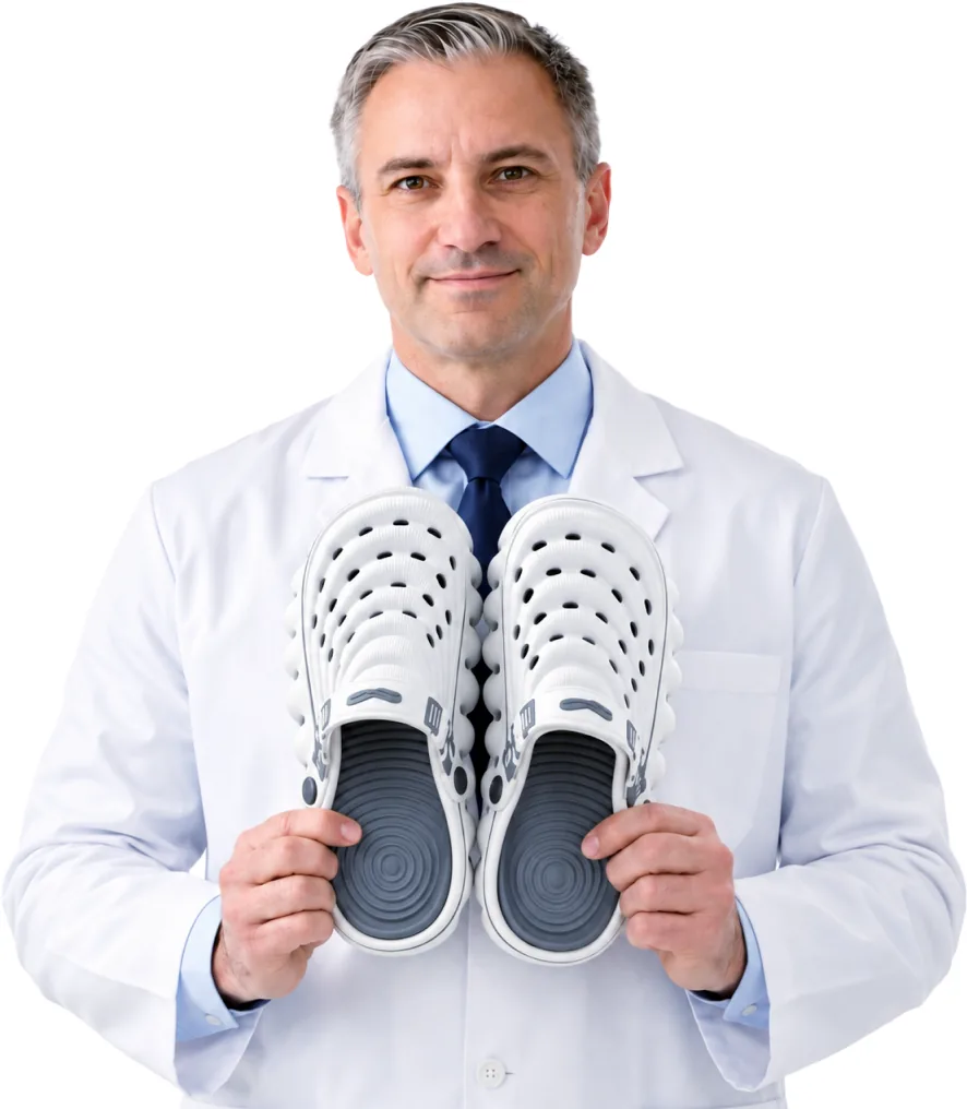 An orthopedic specialist holding Restore Clogs in White Cloud