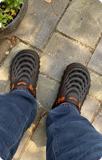 Customer photo: Restore Clogs in Black Ember on a patio