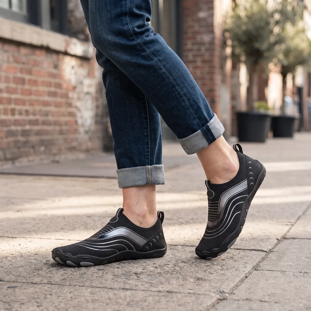 Glide in Black Onyx worn on a city sidewalk