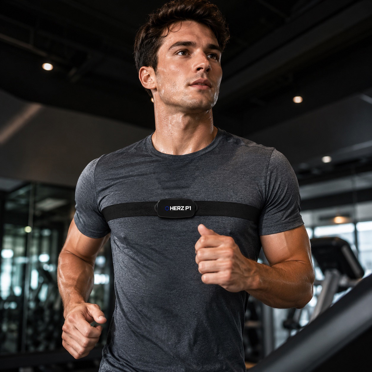 Man running on a treadmill wearing the Herz P1 heart rate chest strap