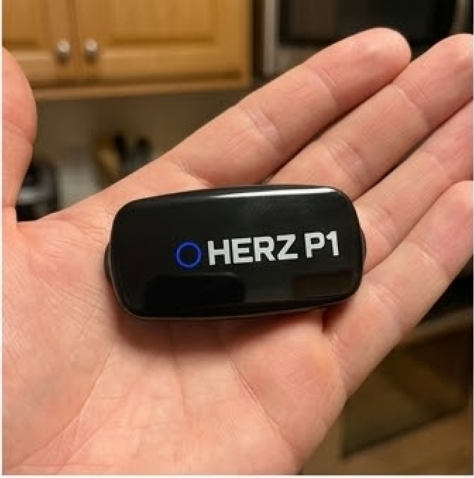 Hand holding the Herz P1 sensor module