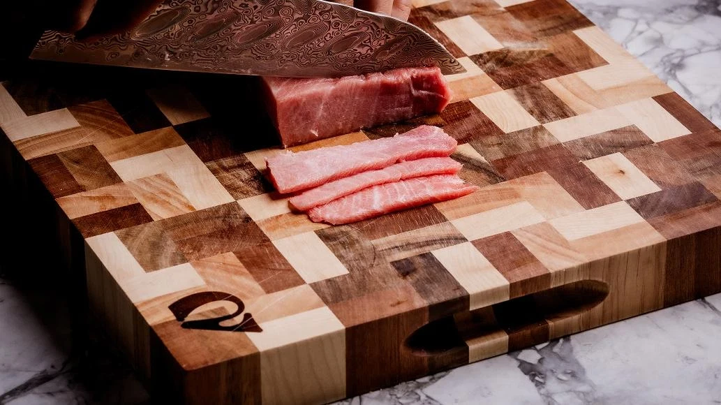 cutting meat with a chef knife