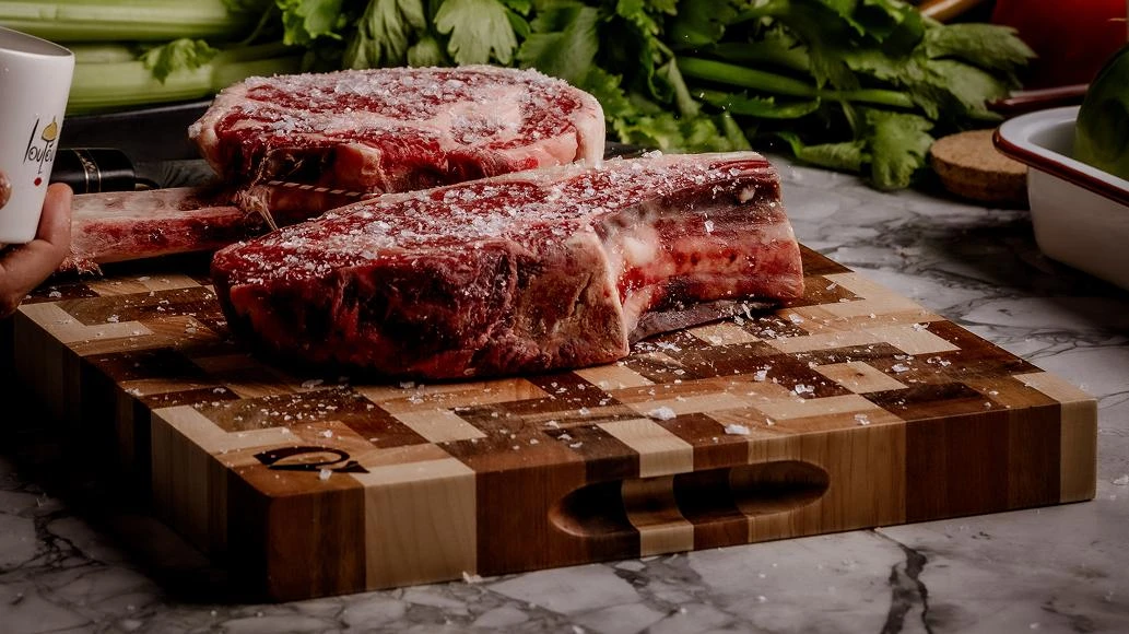 preparing meat with a chef knife