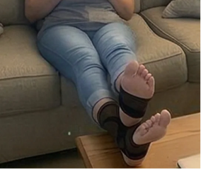 Customer resting with foot compression support