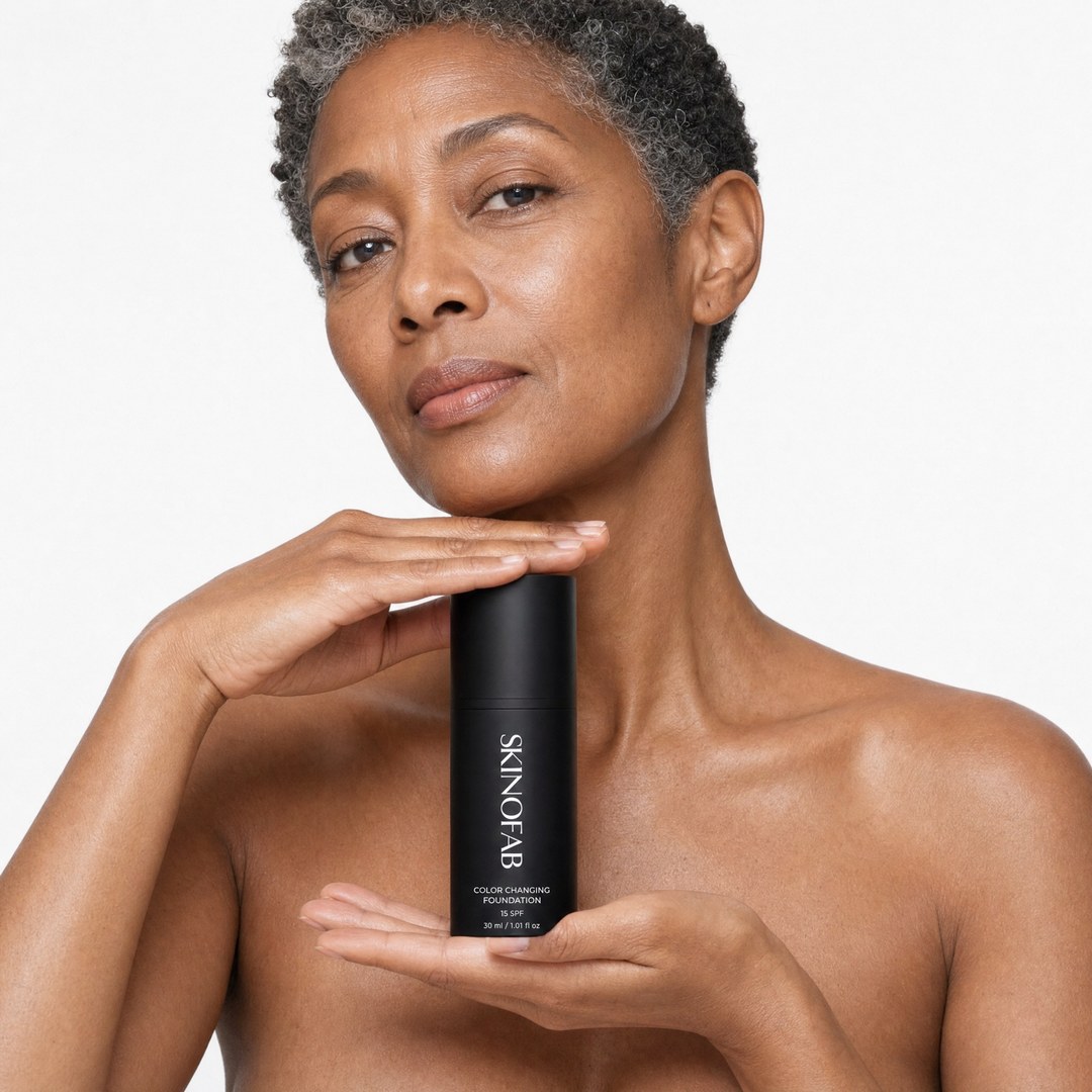 Person holding a pink bottle labeled 'Skinofab' close to their face.