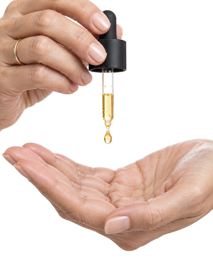 Two drops of serum from the dropper into a palm