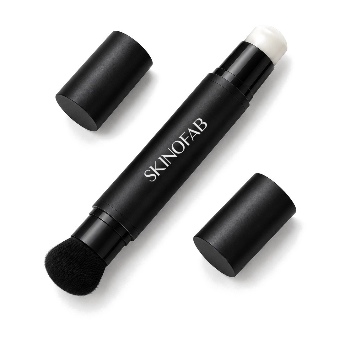 The Adaptive Foundation Stick open at both ends: the white cream and the kabuki brush