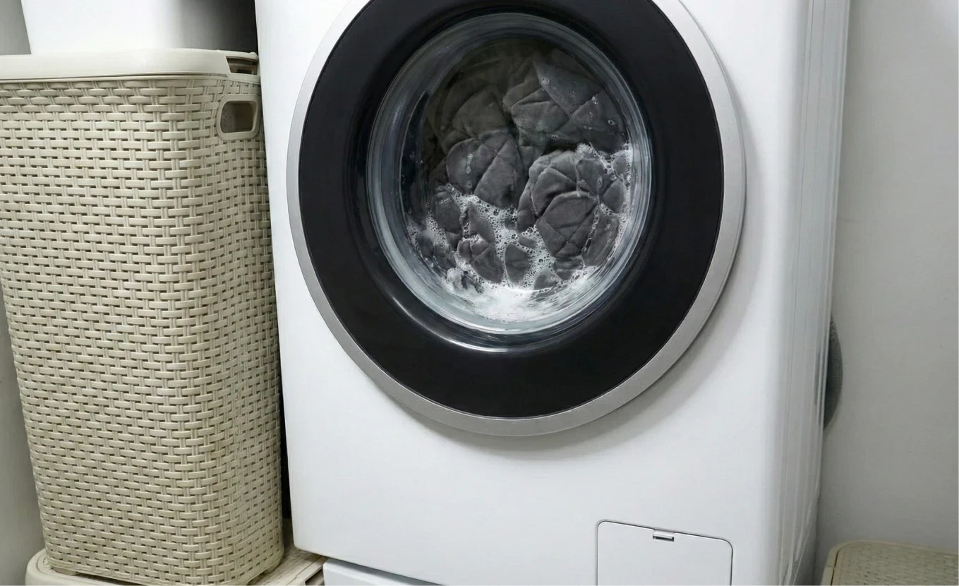 Velin Weighted Blanket being placed in a washing machine