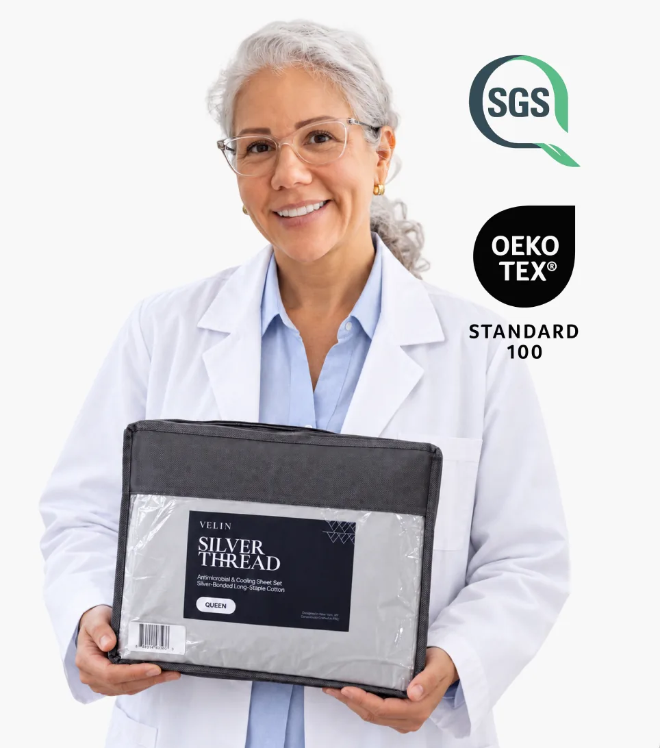 Sleep specialist holding a Velin Silver Thread sheet set, with SGS and OEKO-TEX Standard 100 marks