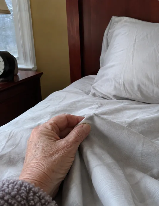 Close-up of a hand resting on Velin sheets