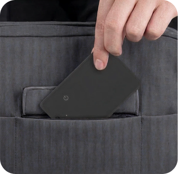 Voyge Smart Locator sliding into a wallet card slot