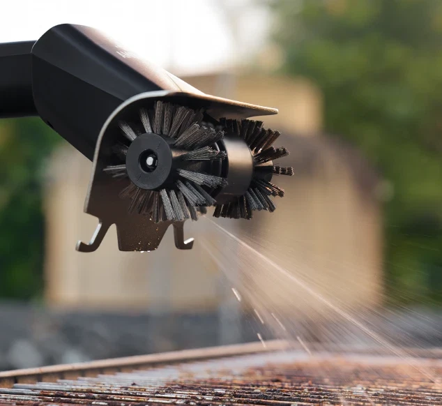 GrillMaster spraying water on a grill