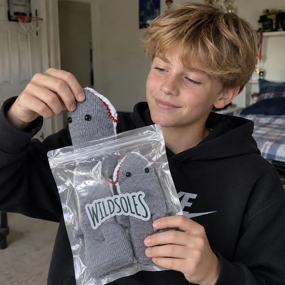 Opening a package of Finn the Shark socks