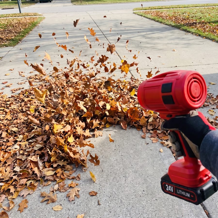 Clearing a driveway one-handed with the WOODRANGER Power Leaf Blower