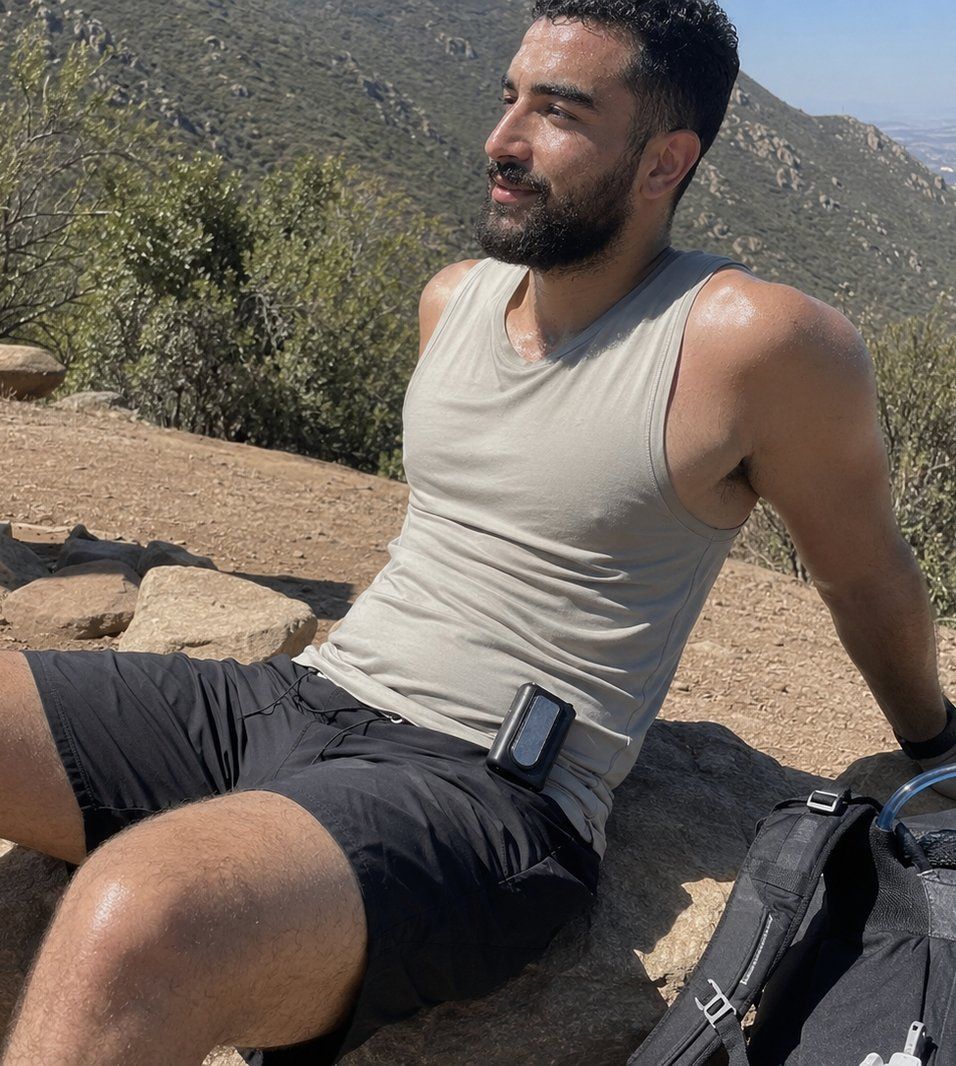 Hiker resting with the Arctic Clip on his waistband