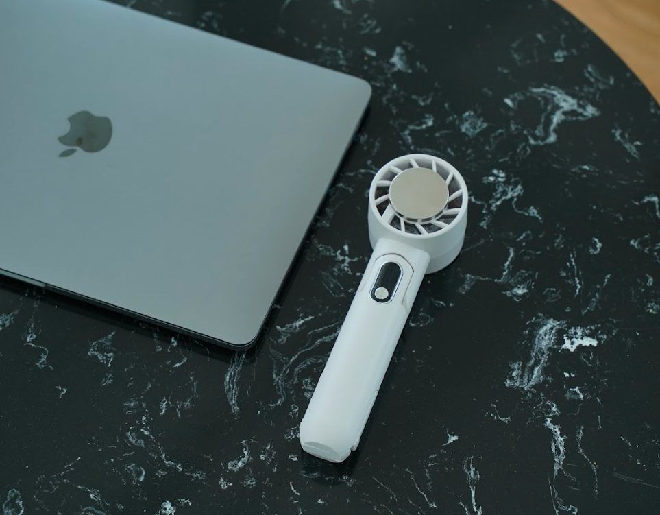 IceForce on a marble desk beside a laptop