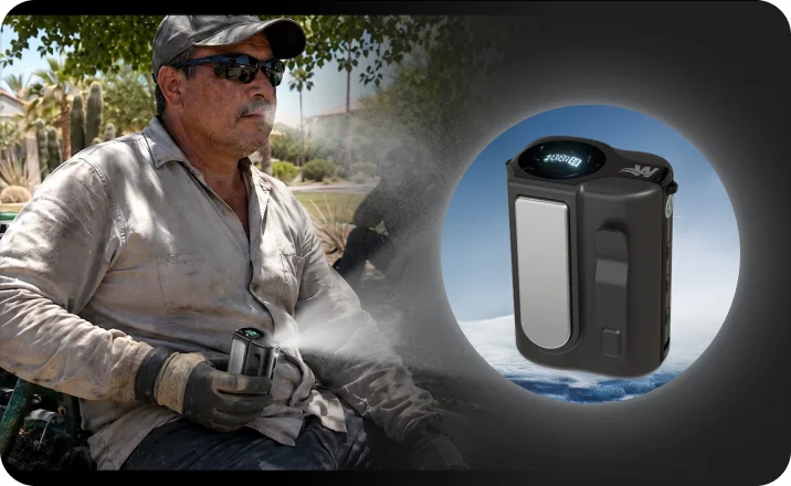 Landscaping crew lead working in the Arizona heat, with the Arctic Clip cooling device beside him